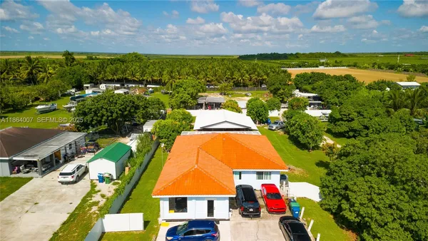 a view of a garden with a building in the background