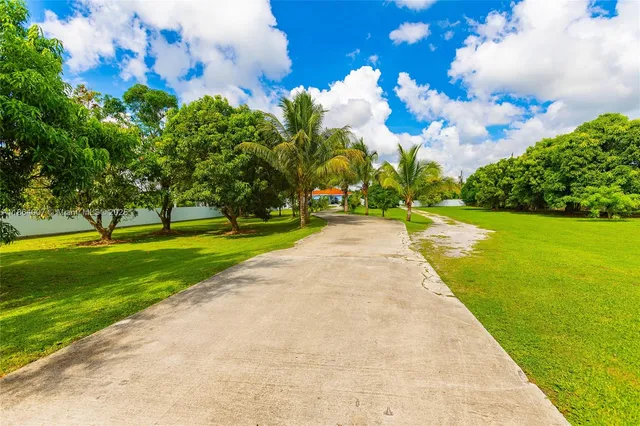 a kitchen with stainless steel appliances granite countertop sink stove and refrigerator