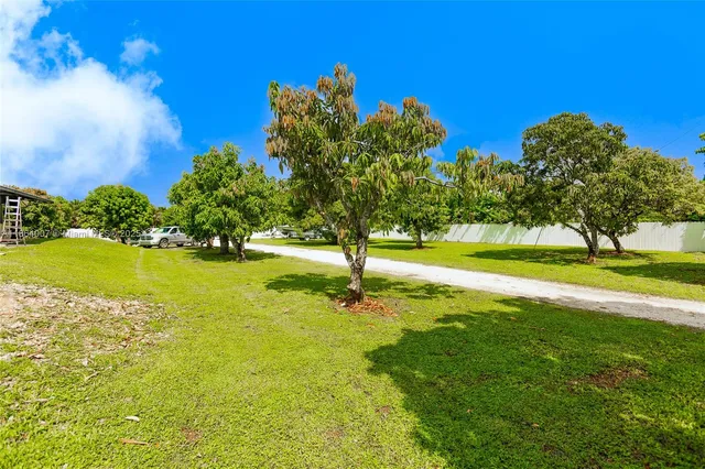 a bathroom with a toilet a sink and a mirror