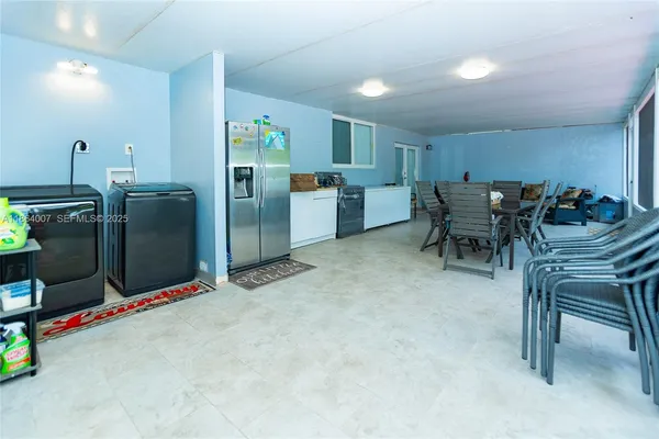 a view of yard with patio