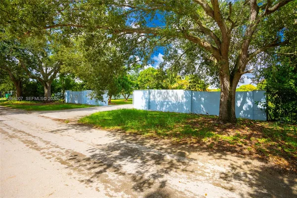 a backyard of a house with lots of green space