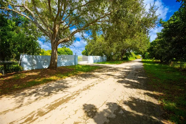 an aerial view of residential house with outdoor space and swimming pool