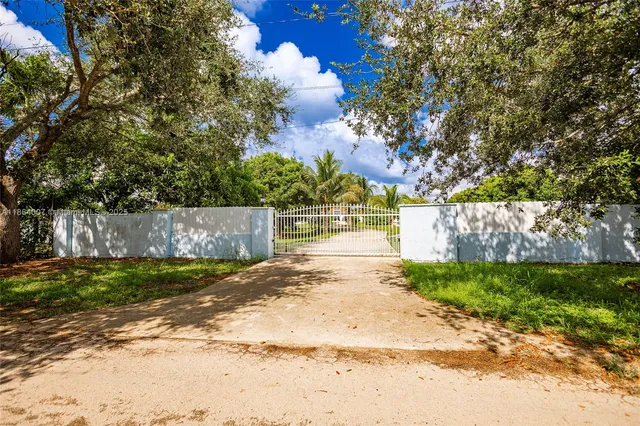 an aerial view of swimming pool patio and swimming pool