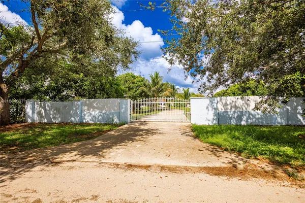 an aerial view of residential house with outdoor space and swimming pool