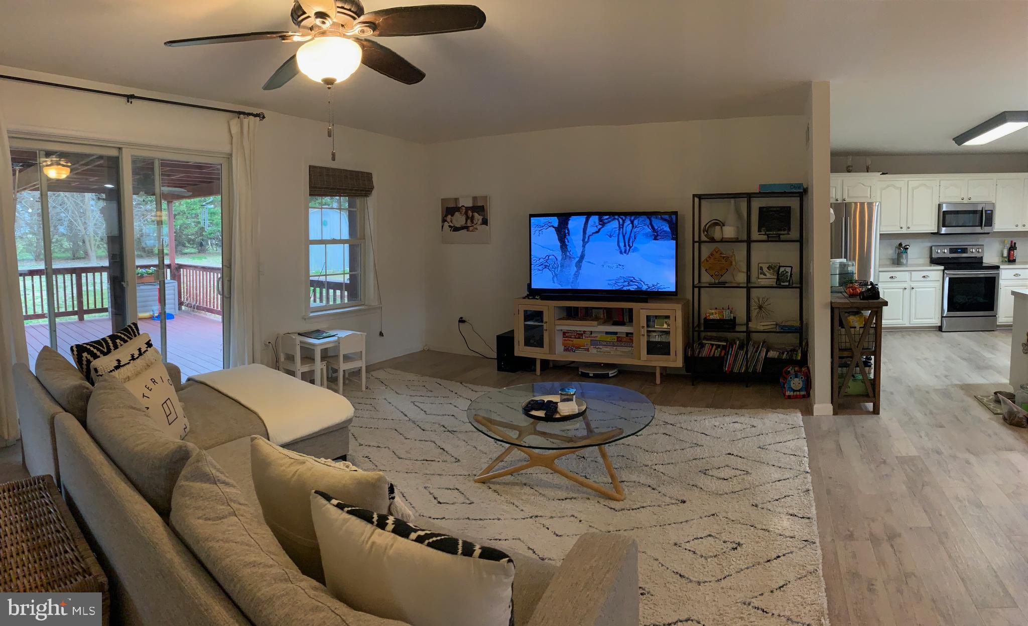 3492 Midstate Road Felton, DE 19943 - Photo 10 of 27 Living Room Opens to Outside Deck & Seating Area