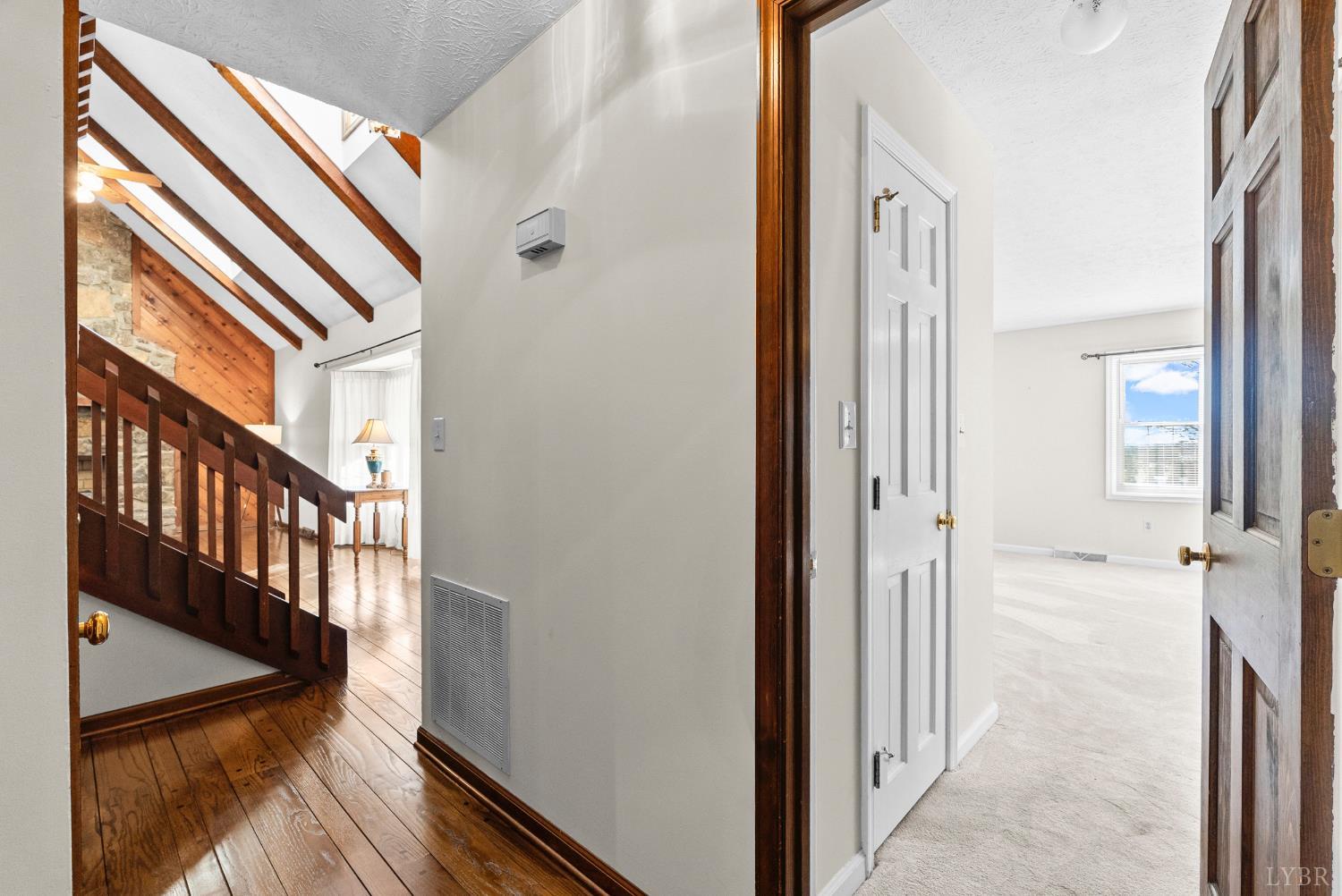 1159 Cifax Road Forest, VA 24551 - Photo 19 of 60 a view of a hallway with wooden floor and staircase
