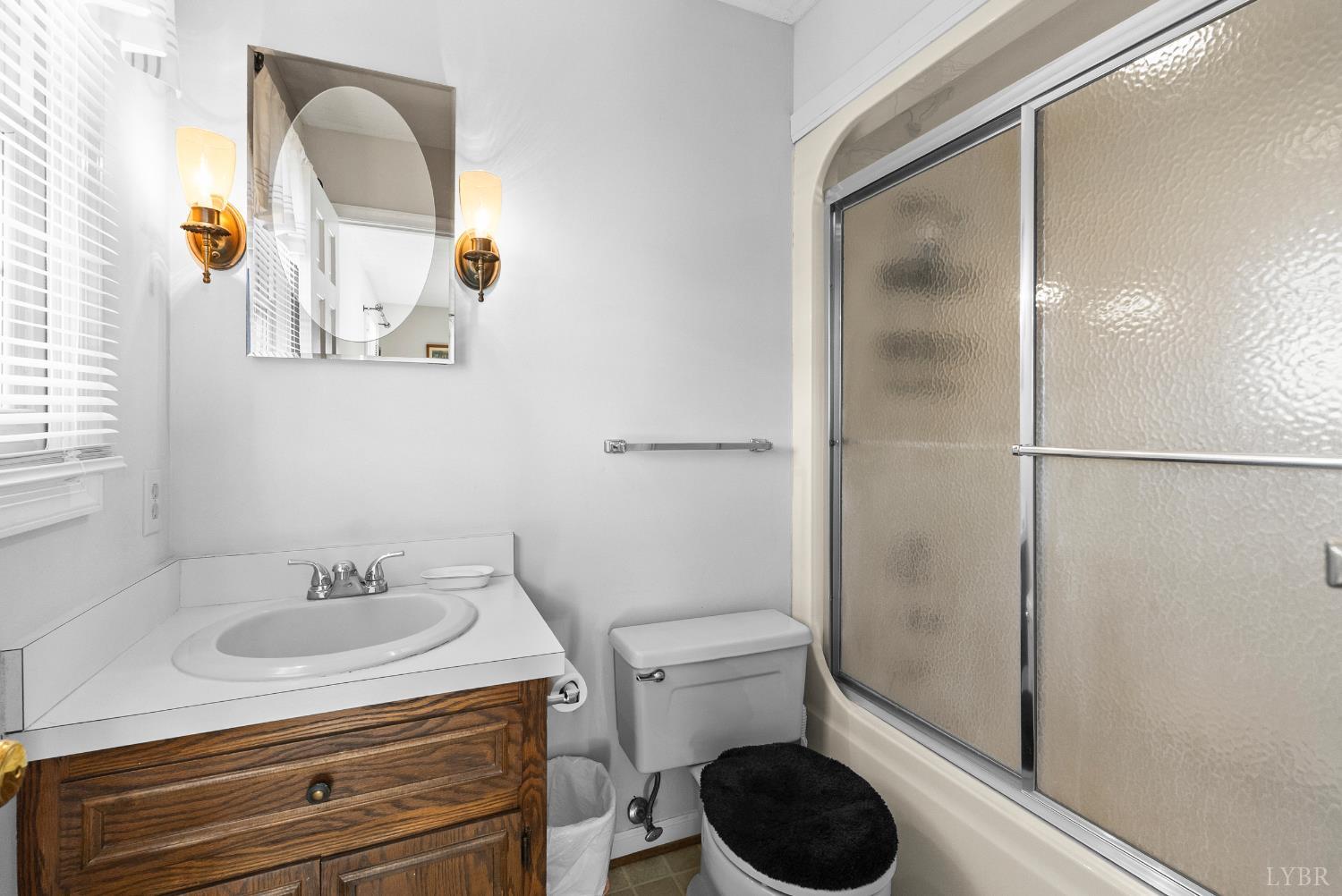 1159 Cifax Road Forest, VA 24551 - Photo 22 of 60 a bathroom with a sink and a mirror