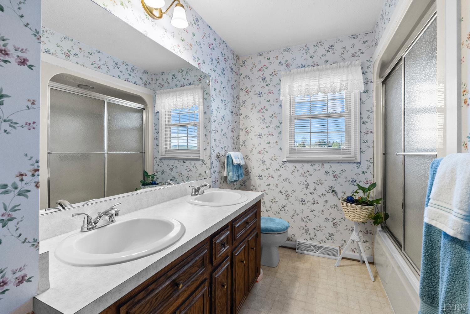 1159 Cifax Road Forest, VA 24551 - Photo 25 of 60 a bathroom with a sink double vanity and a bathtub