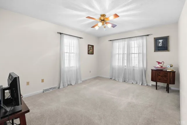 a view of staircase with railing and stairs