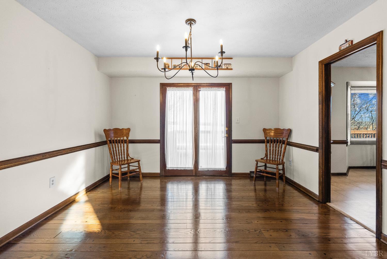 1159 Cifax Road Forest, VA 24551 - Photo 9 of 60 a view of a room with wooden floor staircase and a chandelier