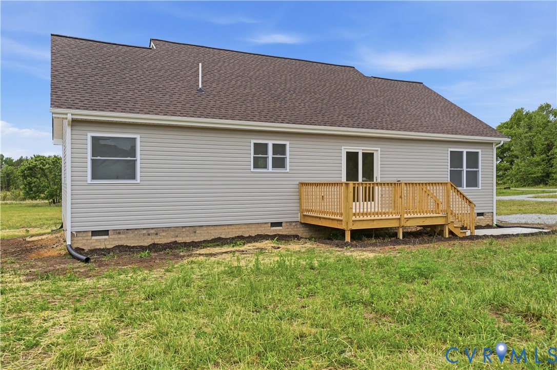 7839 King William Road Aylett, VA 23009 - Photo 34 of 38 a white house that has a small yard and a wooden fence