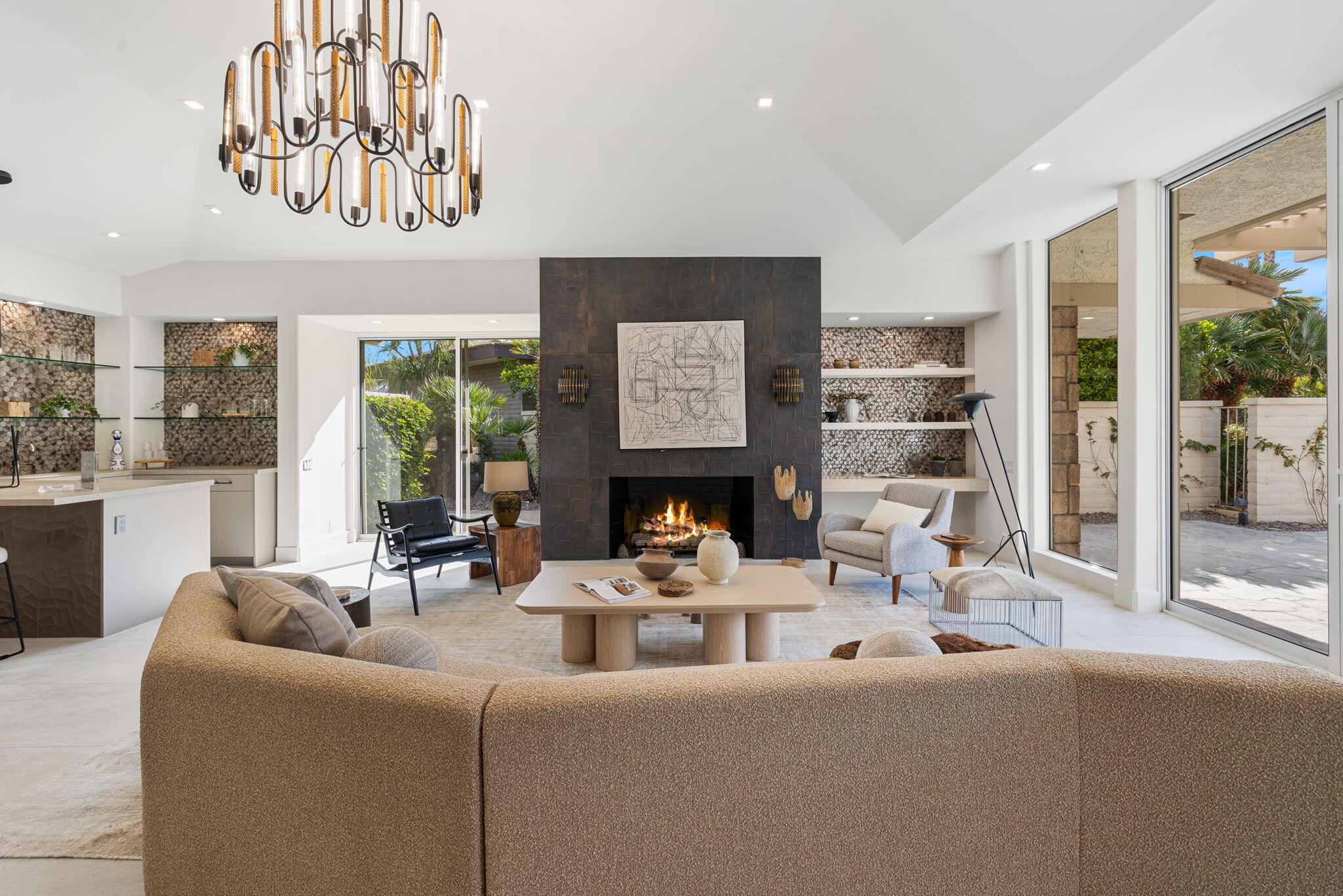 9 Regency Drive Rancho Mirage, CA 92270 - Photo 12 of 86 a living room with furniture a fireplace and a large window