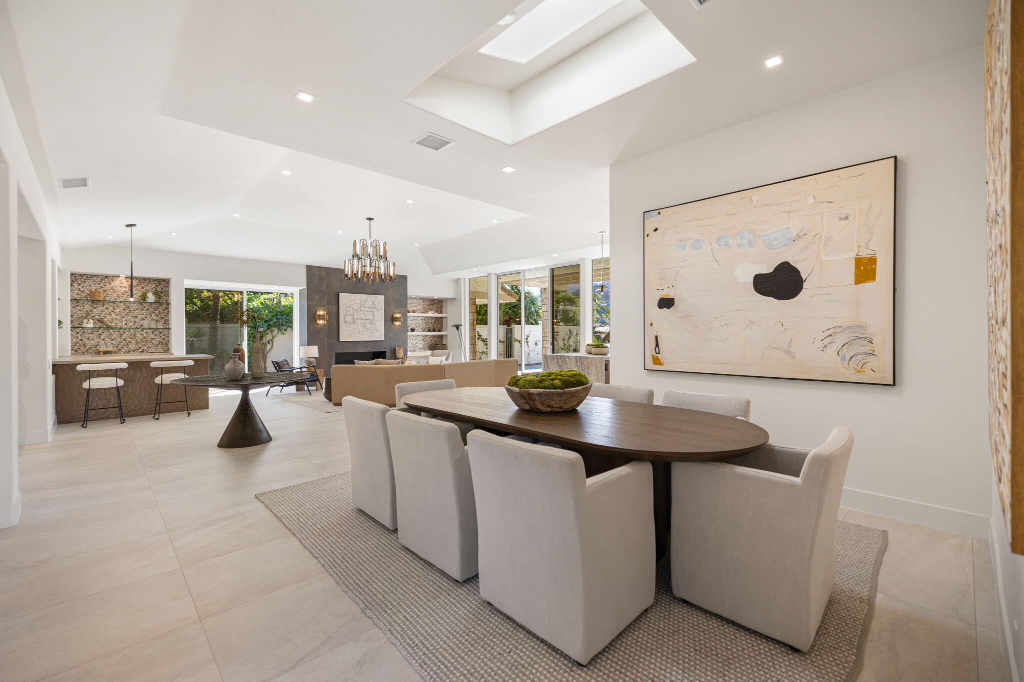 9 Regency Drive Rancho Mirage, CA 92270 - Photo 13 of 86 a kitchen with stainless steel appliances kitchen island granite countertop a sink and a white cabinets