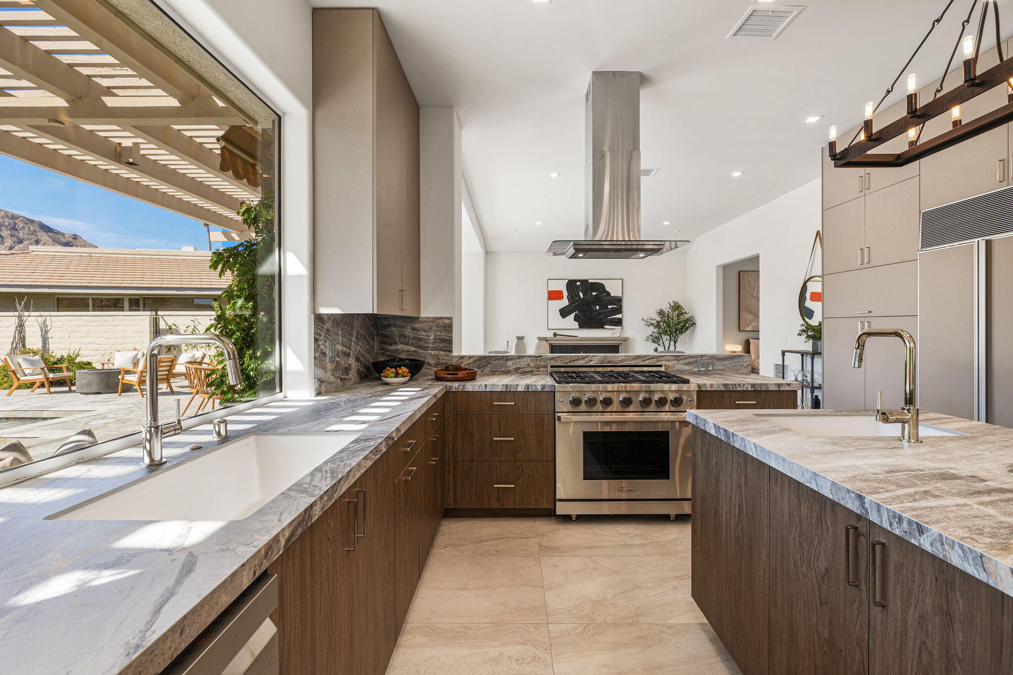 9 Regency Drive Rancho Mirage, CA 92270 - Photo 25 of 86 a large kitchen with stainless steel appliances granite countertop a sink stove and refrigerator