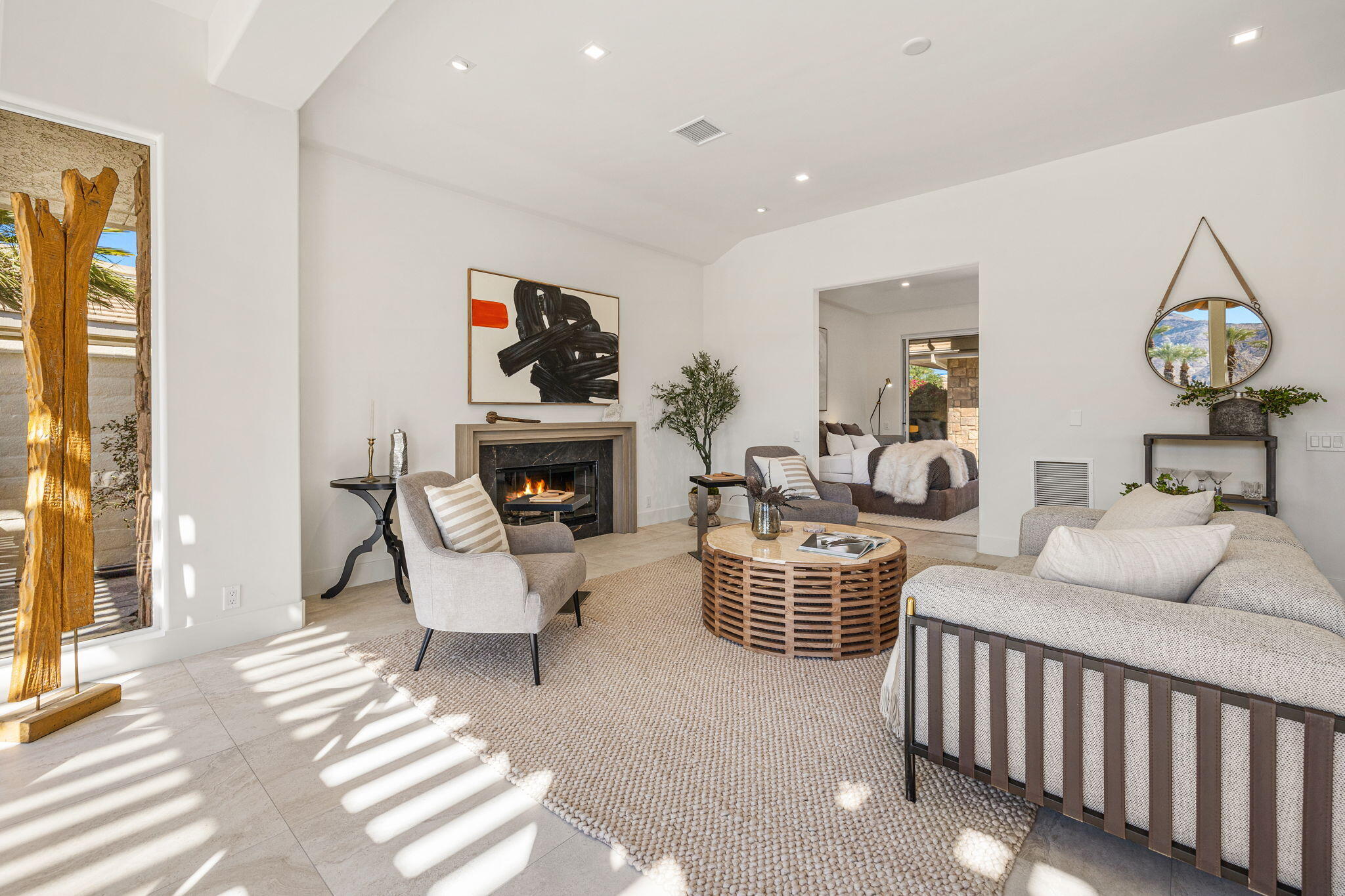 9 Regency Drive Rancho Mirage, CA 92270 - Photo 31 of 86 a living room with furniture a fireplace and decor