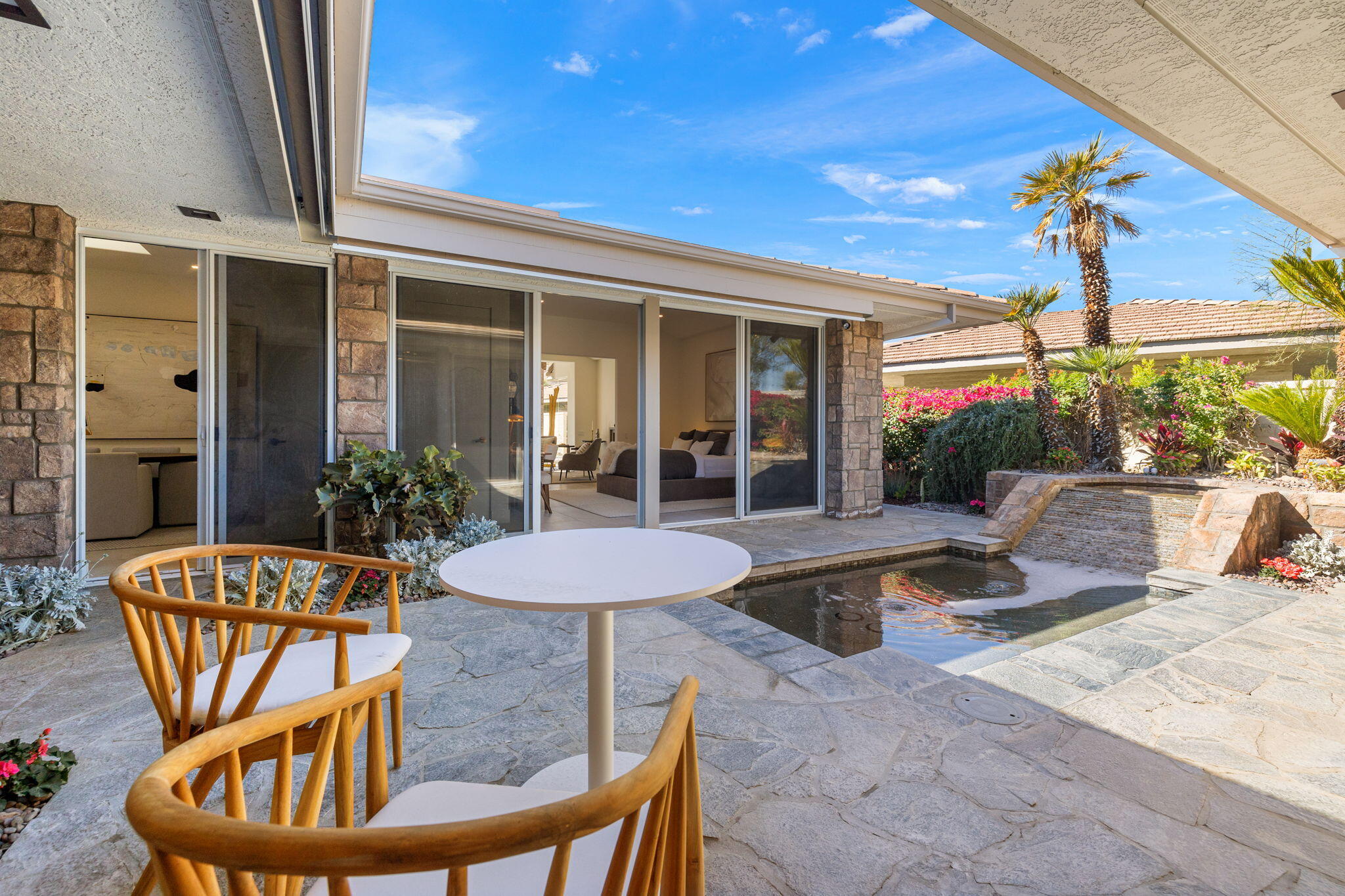9 Regency Drive Rancho Mirage, CA 92270 - Photo 35 of 86 a view of a house with porch patio and swimming pool