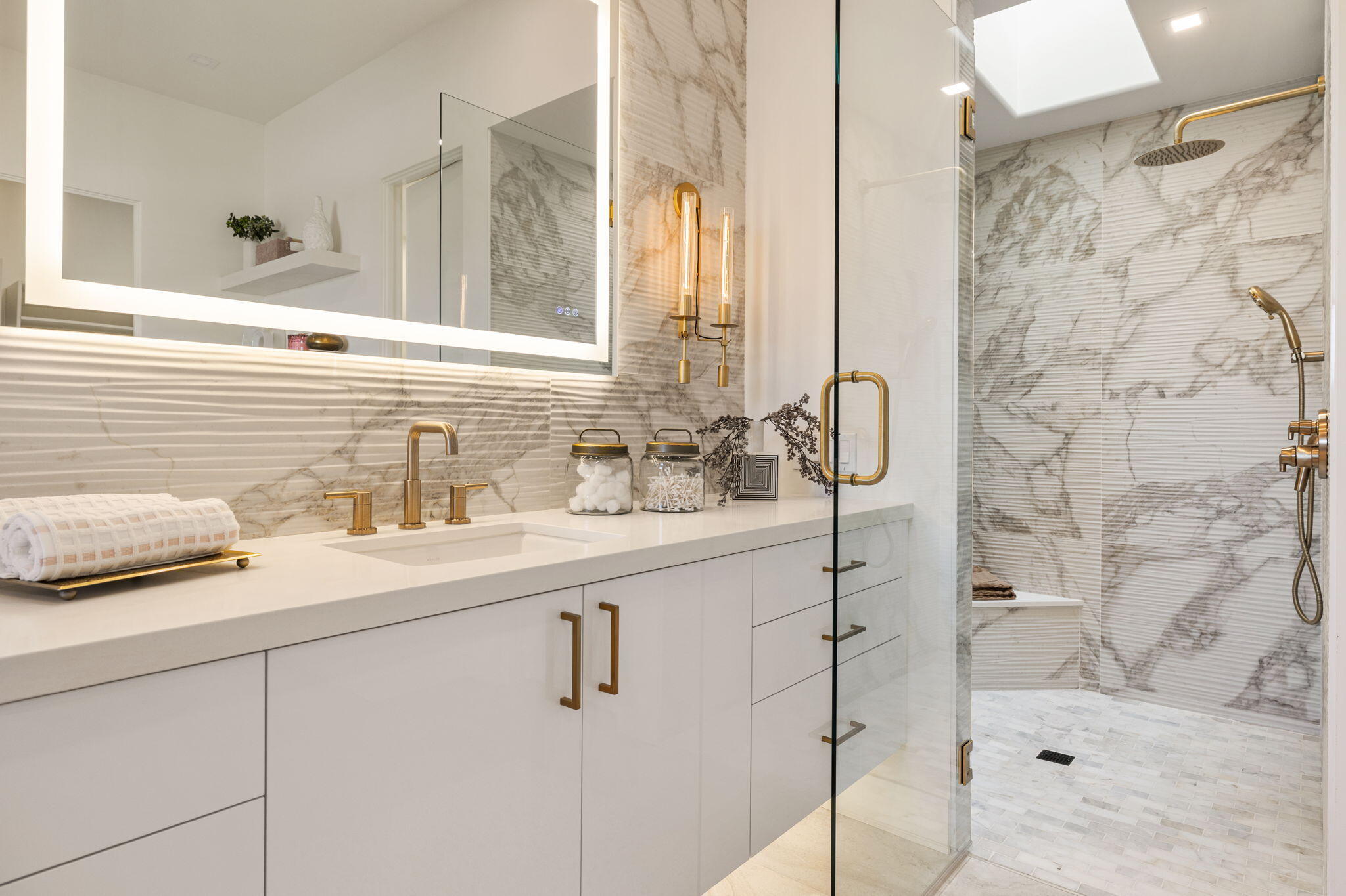 9 Regency Drive Rancho Mirage, CA 92270 - Photo 50 of 86 a bathroom with a sink and a mirror