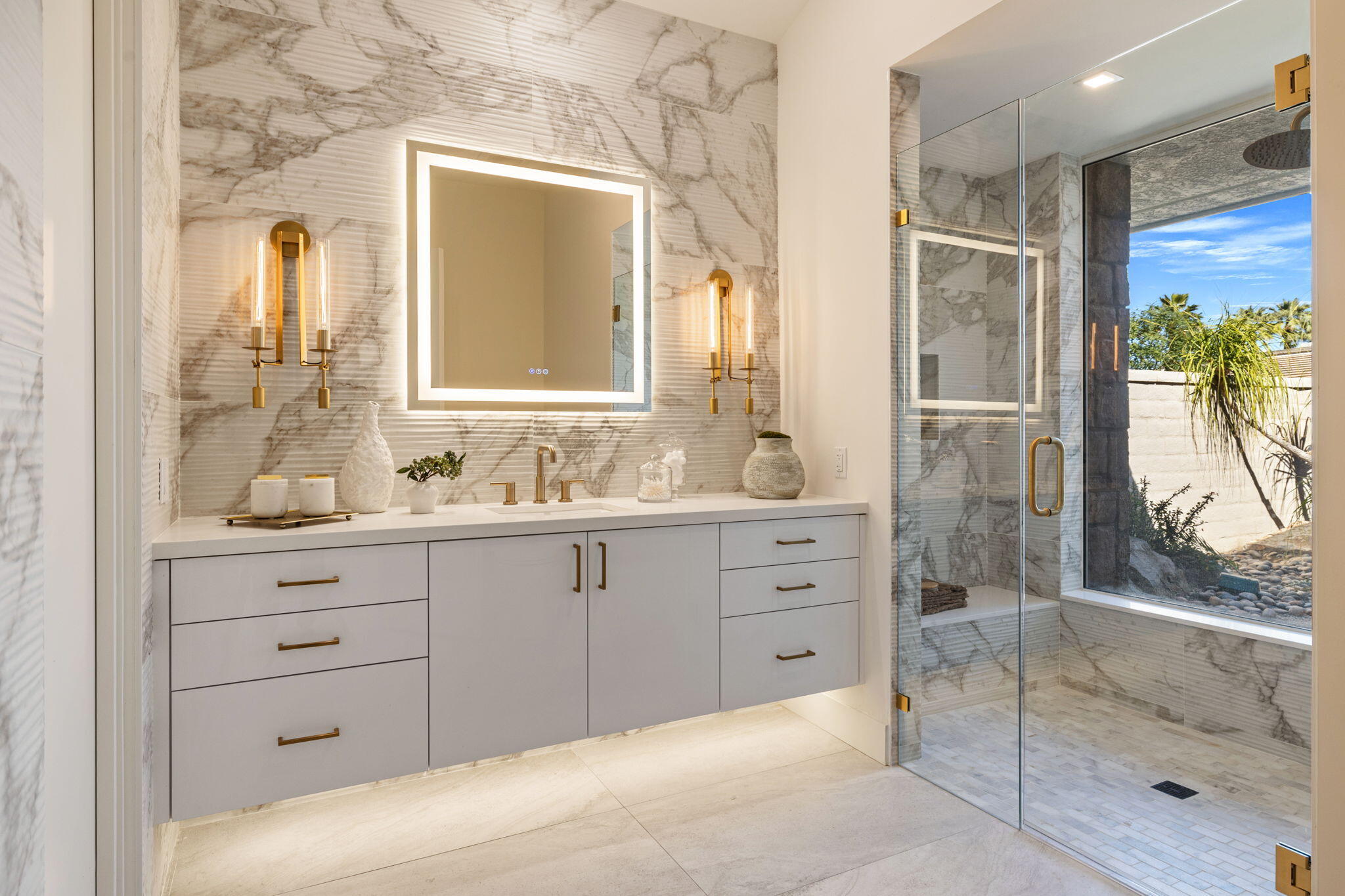 9 Regency Drive Rancho Mirage, CA 92270 - Photo 54 of 86 a bathroom with a granite countertop sink a mirror and a shower