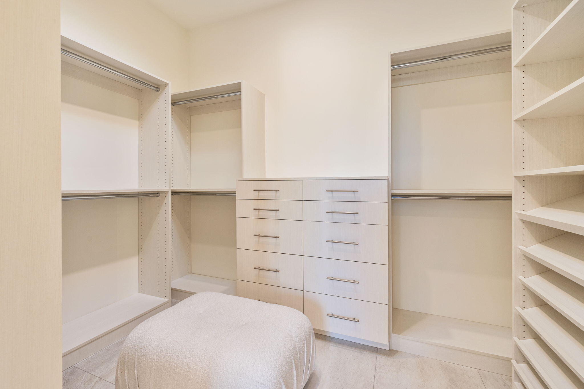 9 Regency Drive Rancho Mirage, CA 92270 - Photo 57 of 86 a bedroom with a bed and cabinets