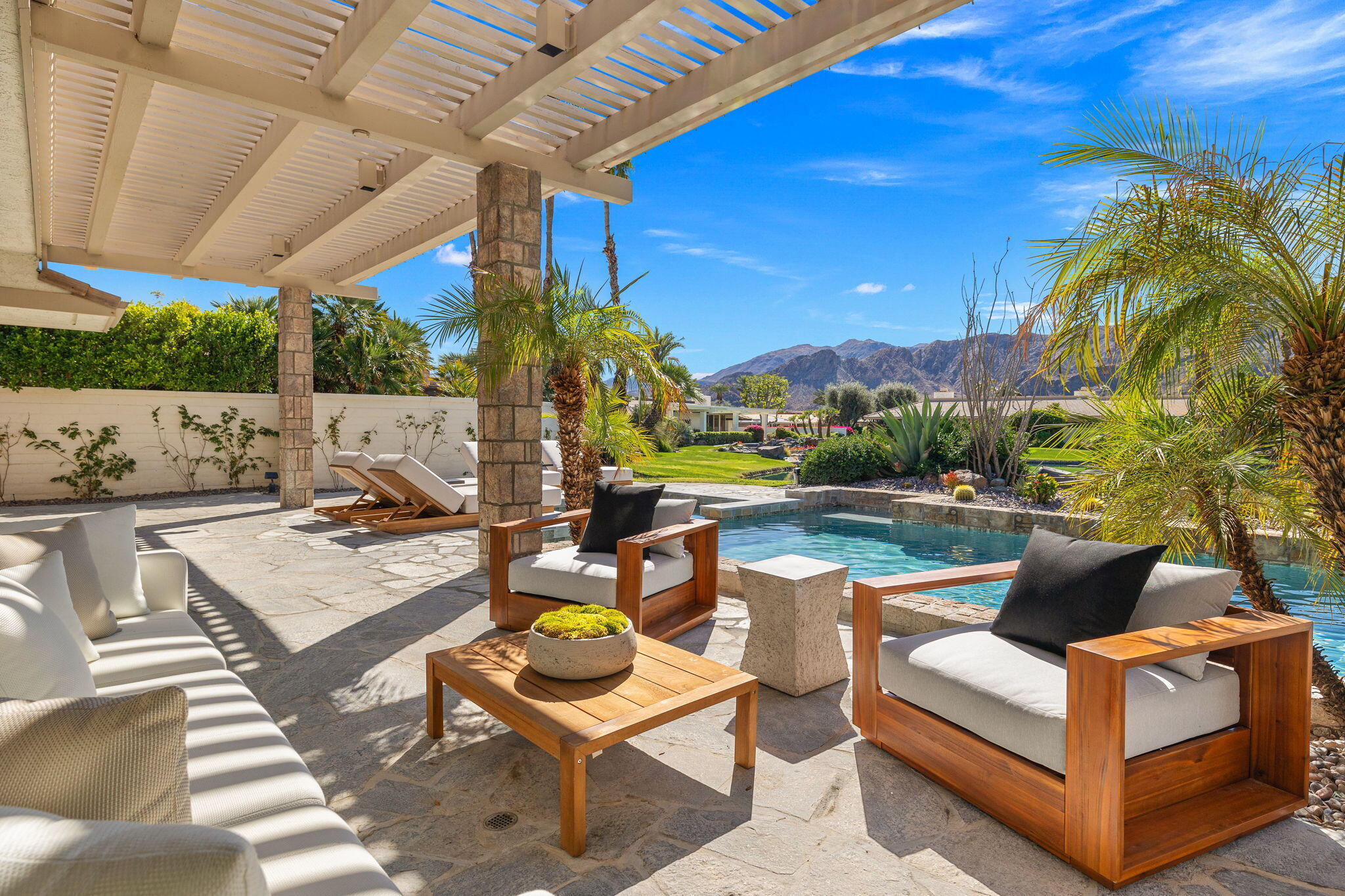 9 Regency Drive Rancho Mirage, CA 92270 - Photo 76 of 86 a view of an outdoor sitting area with furniture and a backyard