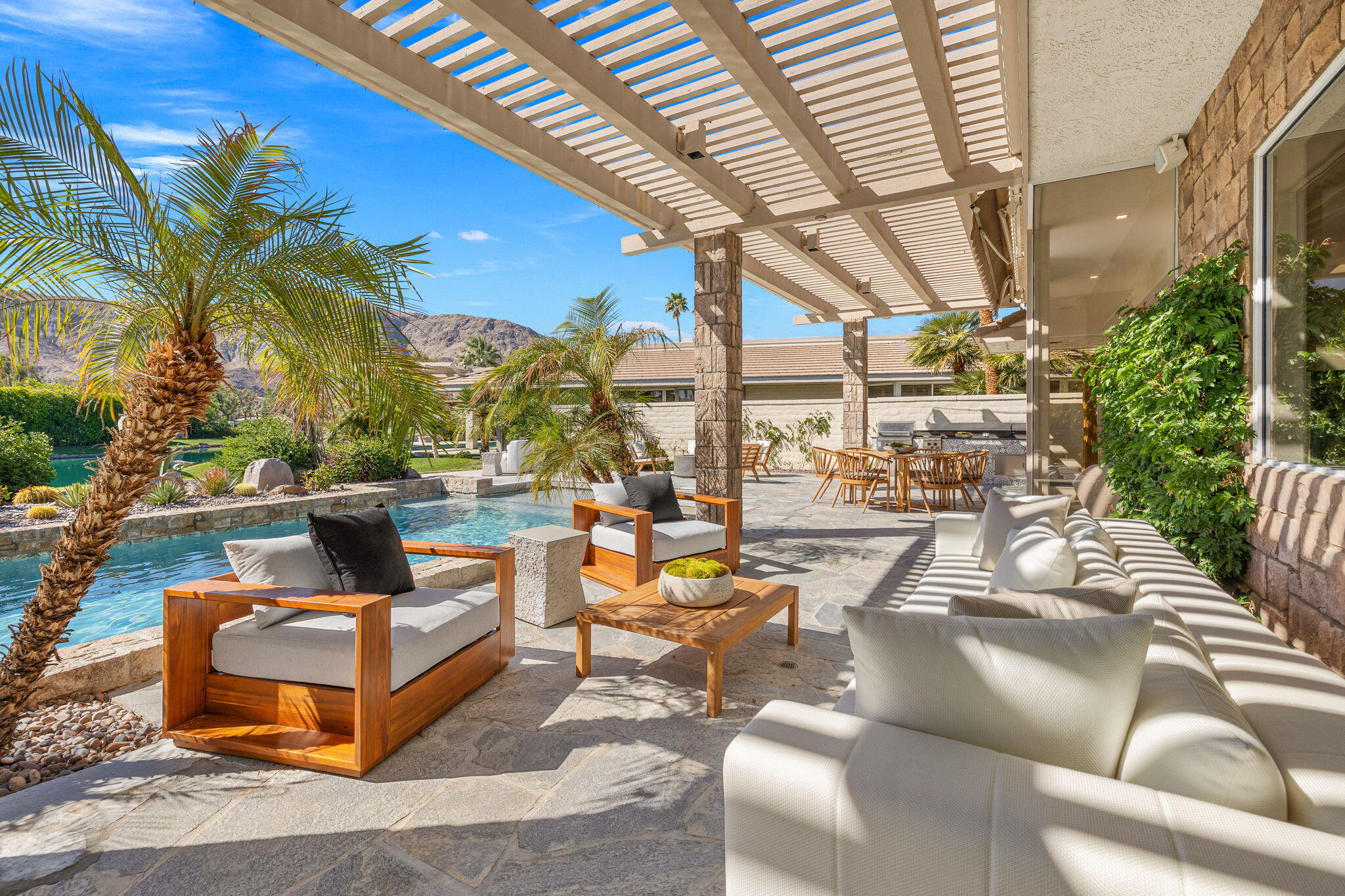 9 Regency Drive Rancho Mirage, CA 92270 - Photo 77 of 86 a view of a patio with couches and a fire pit