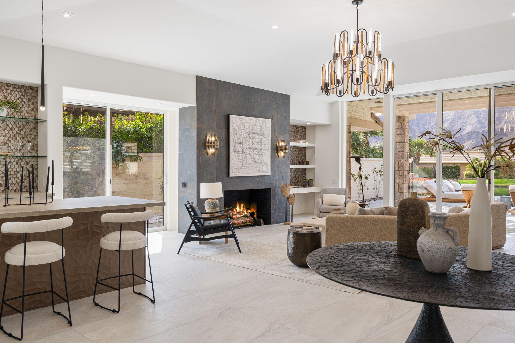 9 Regency Drive Rancho Mirage, CA 92270 - Photo 8 of 86 a living room with furniture a chandelier and a chandelier