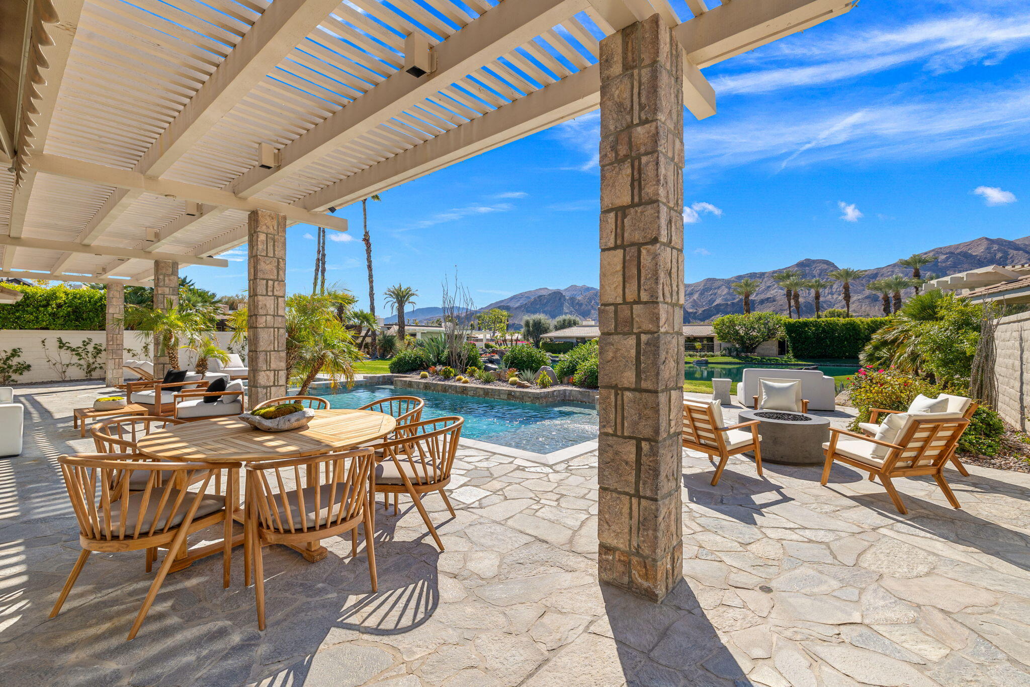 9 Regency Drive Rancho Mirage, CA 92270 - Photo 82 of 86 a view of swimming pool with outdoor seating and city view