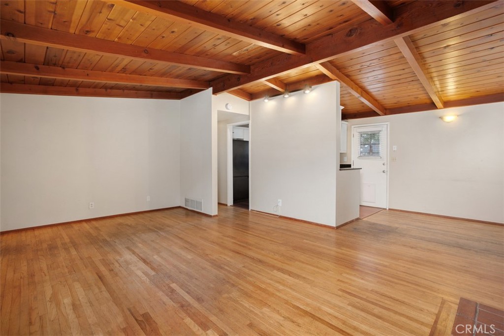 1710 Valley Place Carlsbad, CA 92008 - Photo 3 of 31 a view of an empty room with wooden floor