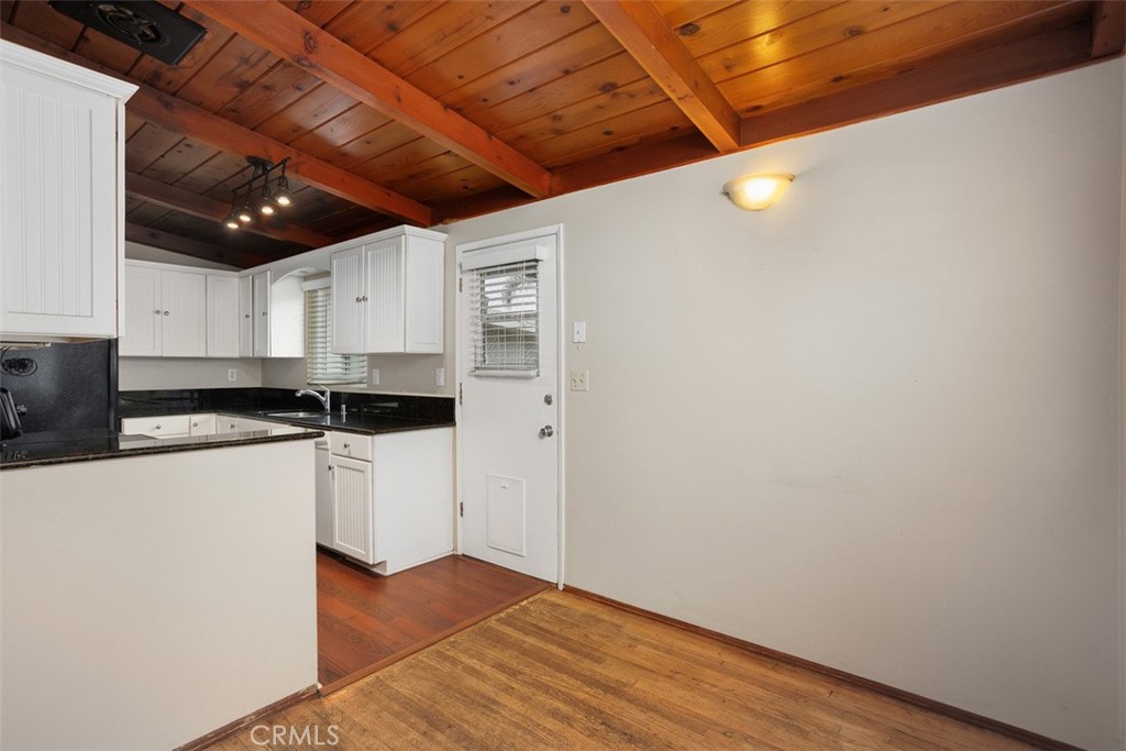 1710 Valley Place Carlsbad, CA 92008 - Photo 9 of 31 a kitchen with granite countertop a sink and cabinets