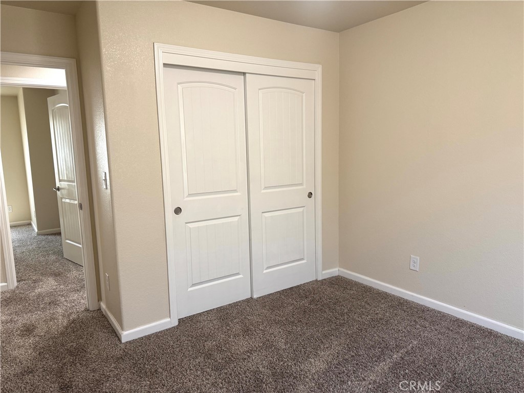 1339 Playa Del Rey Drive Merced, CA 95348 - Photo 31 of 48 an empty room that has a wooden cupboard