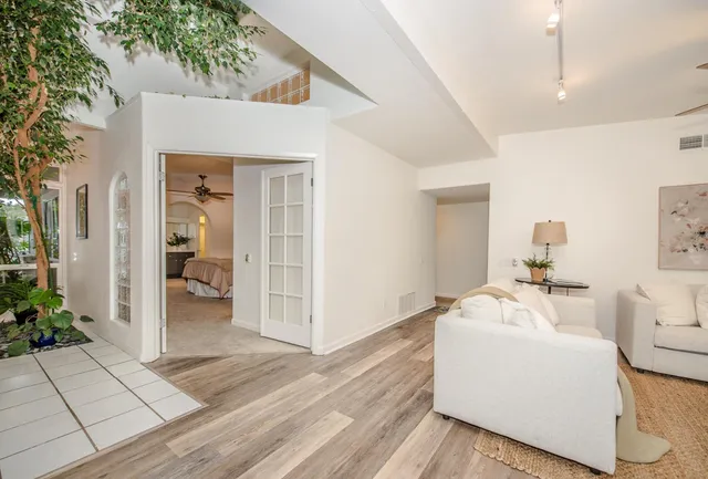 a bedroom with a bed and chair