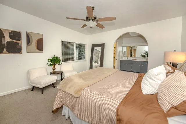 a bathroom with a sink a mirror and a shower