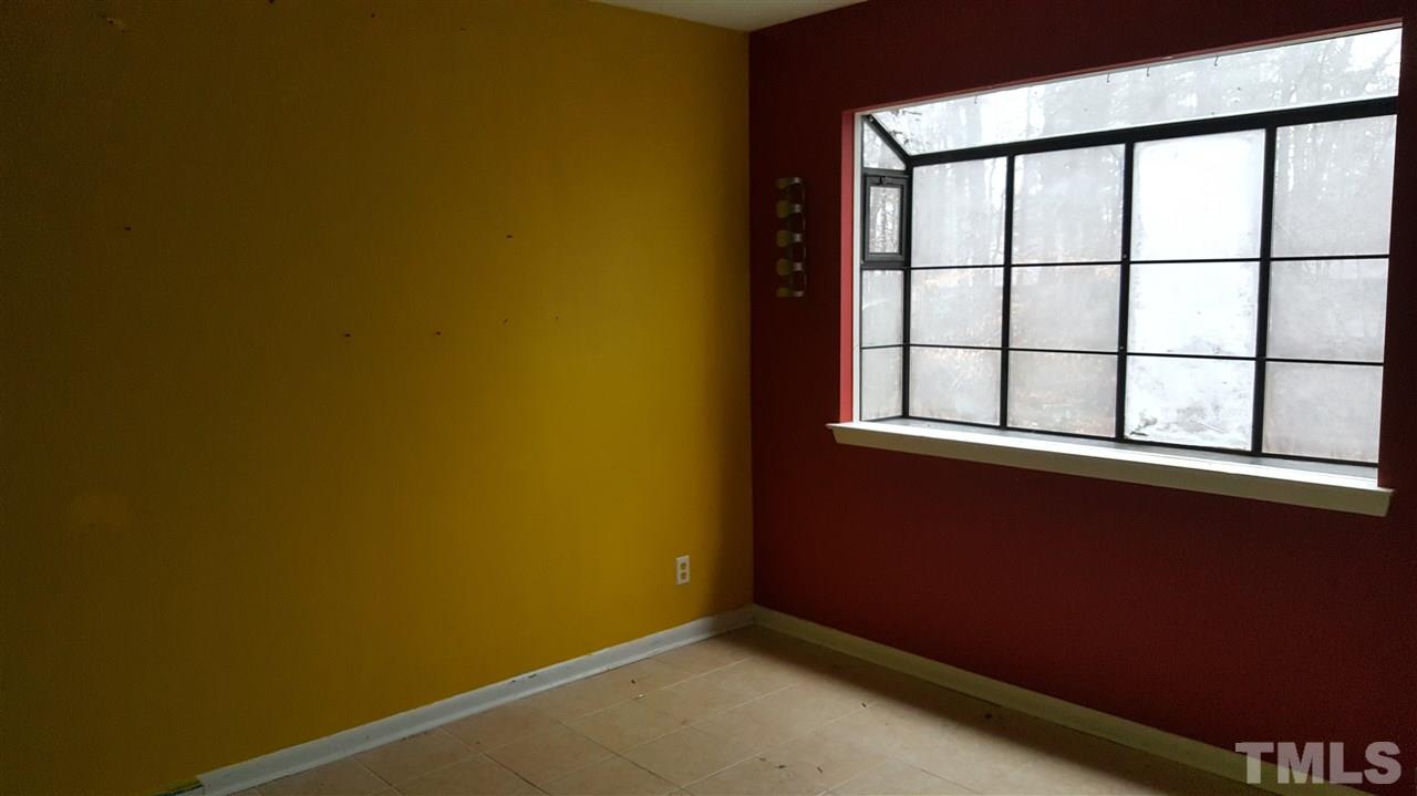 3088 Colony Road, Unit D Durham, NC 27705 - Photo 6 of 11 an empty room with a window