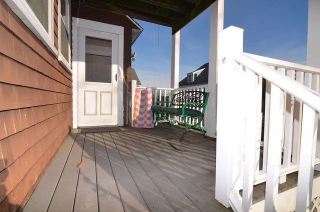 a car parked in front of a brick house