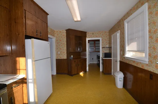 a kitchen with a refrigerator a sink and dishwasher