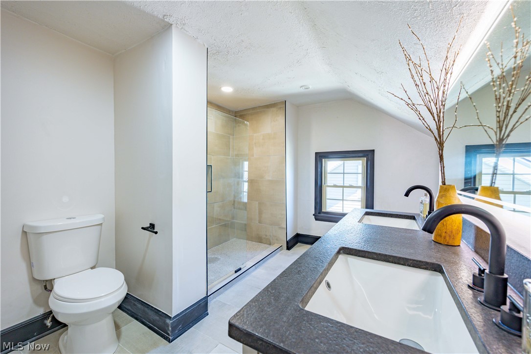 3254 Redwood Road Cleveland Heights, OH 44118 - Photo 25 of 49 Bathroom with toilet, vaulted ceiling, a textured ceiling, walk in shower, and tile flooring