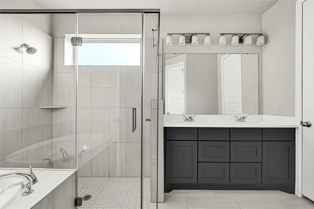 a bathroom with a bathtub and a sink