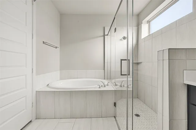 a bathroom with a shower and a sink
