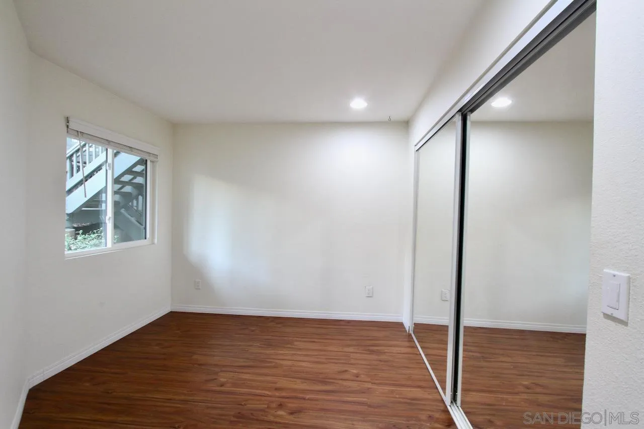 3021 Golden Oak Way Spring Valley, CA 91978 - Photo 10 of 20 a view of empty room with wooden floor and fan