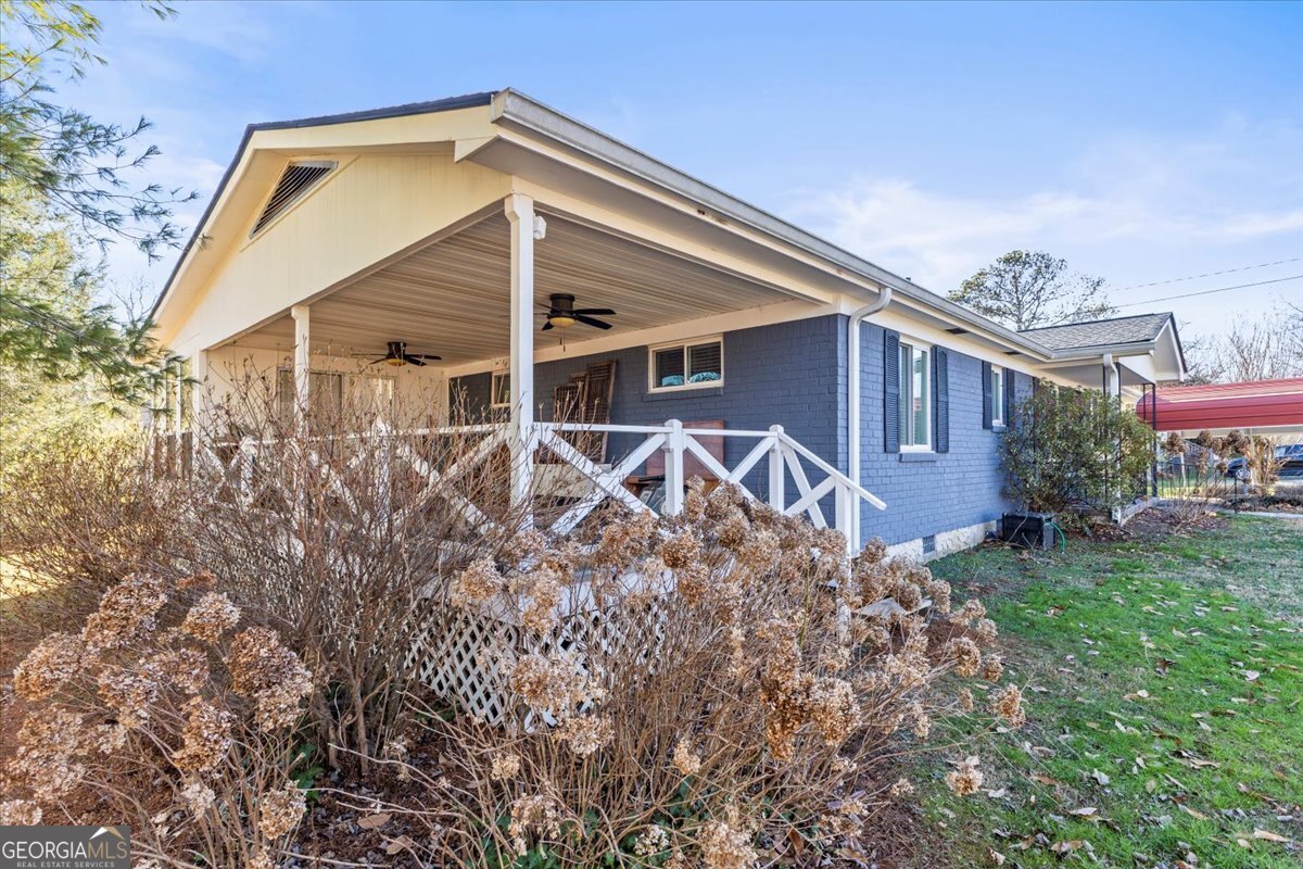 252 Langley Drive LaFayette, GA 30728 - Photo 11 of 29 a backyard of a house with table and chairs