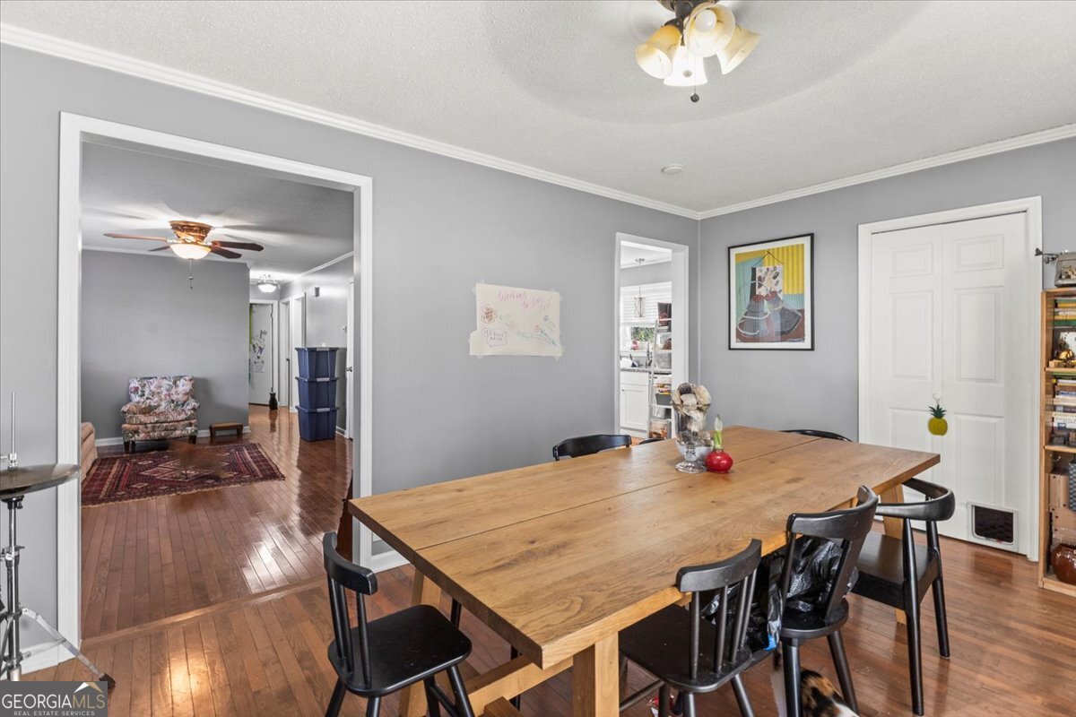 252 Langley Drive LaFayette, GA 30728 - Photo 16 of 29 a view of a dining room with furniture and wooden floor
