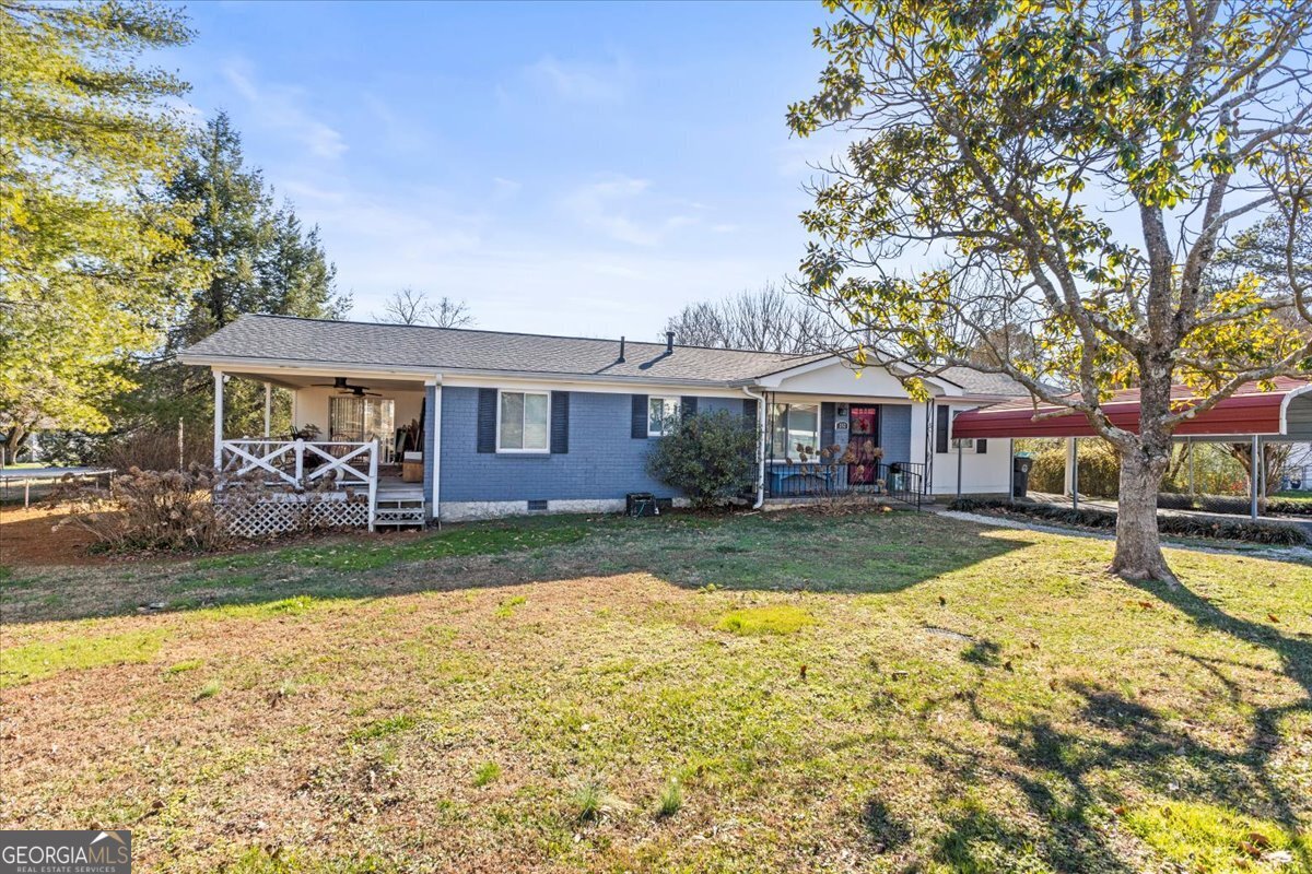 252 Langley Drive LaFayette, GA 30728 - Photo 2 of 29 a view of a house with a yard