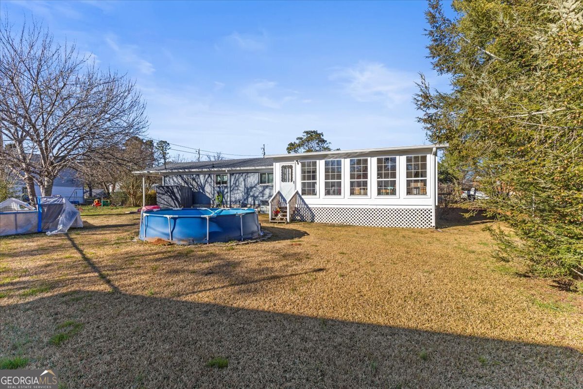 252 Langley Drive LaFayette, GA 30728 - Photo 9 of 29 a view of a house with backyard porch and sitting area