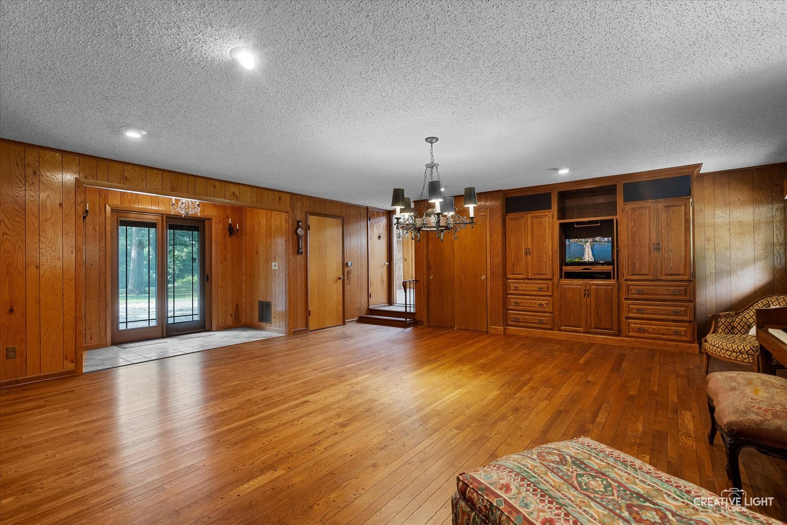 16323 Griswold Springs Road Plano, IL 60545 - Photo 17 of 55 an empty room with wooden floor and windows