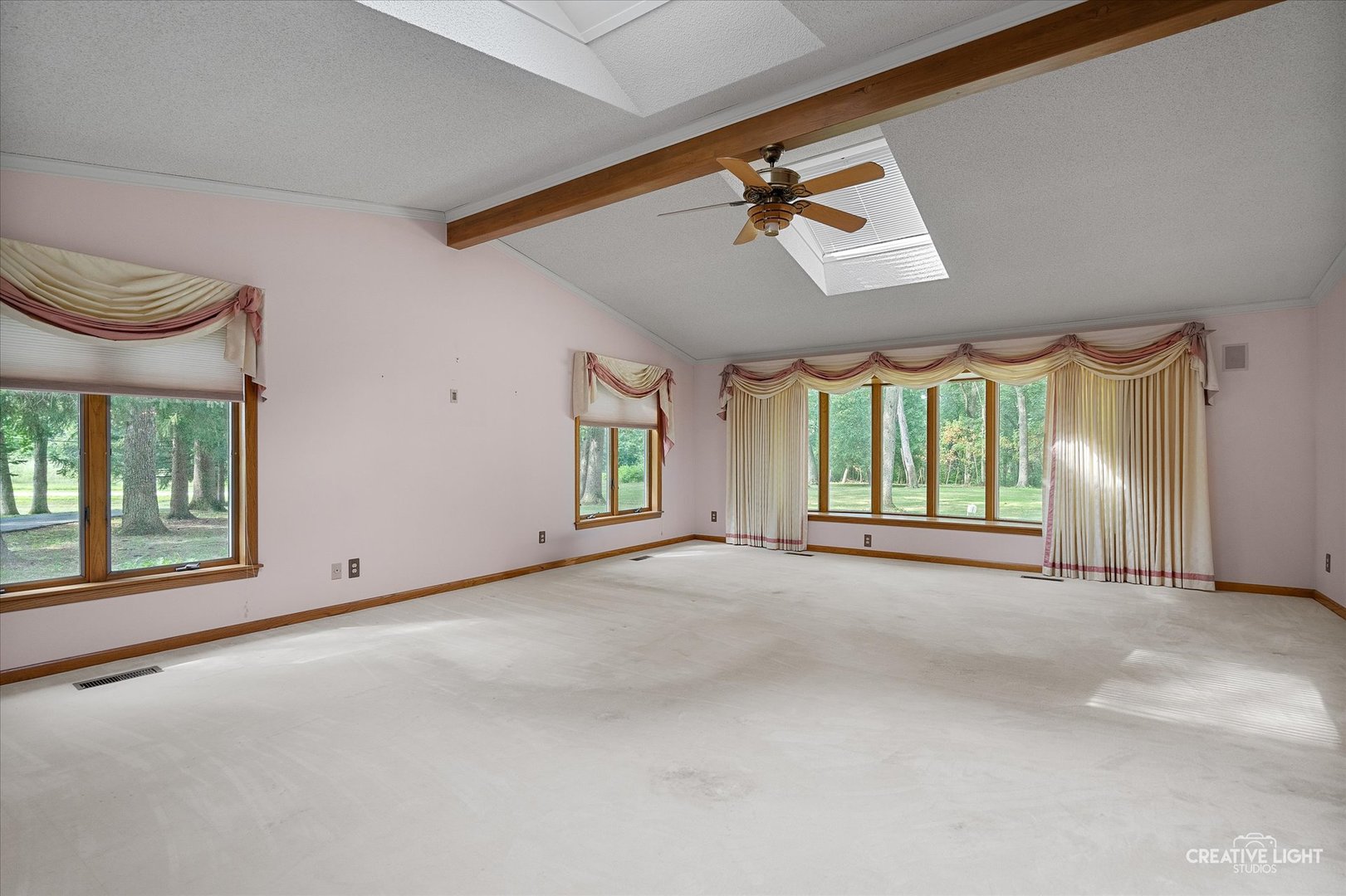 16323 Griswold Springs Road Plano, IL 60545 - Photo 18 of 55 a view of a room with windows and ceiling fan