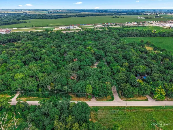 an aerial view of a houses and green space