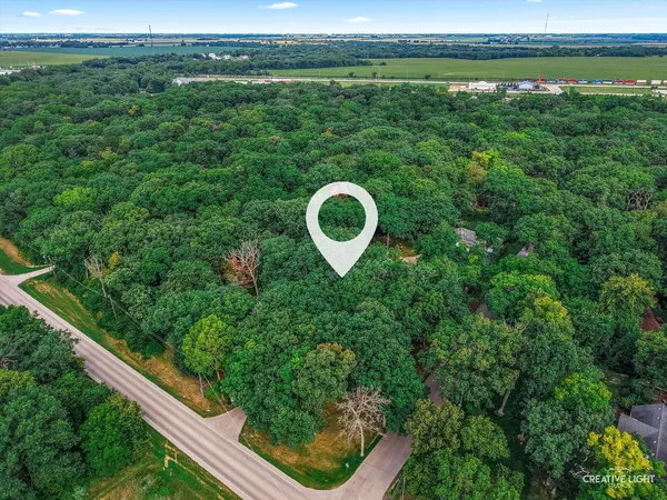 an aerial view of a house with yard
