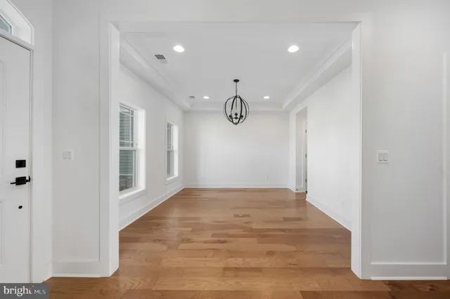 a kitchen with granite countertop stainless steel appliances and wooden cabinets
