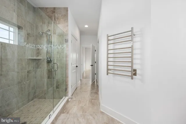 a view of a lake with houses in the back