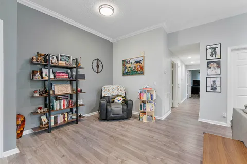 a view of a livingroom with furniture and wooden floor